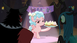 Cozy singing with plate of cupcakes S9E8