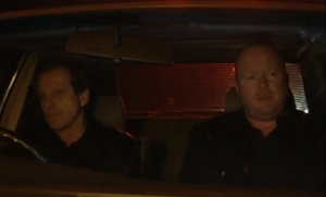 Phil Mitchell and Dirty Den head over to a warehouse for their armed robbery.