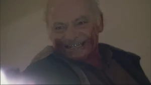Bobby Sr. grinning menacingly as he kills Carlos.