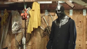 Cam as The Executioner walking towards Brenda.