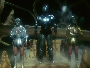 Mara and Kara standing on either side of Shadow Moon.