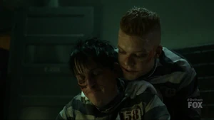 Oswald talks to Jerome in prison cell.