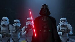 Vader flanked by stormtroopers and approached the rebels with an ignited lightsaber.