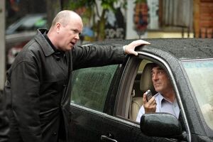 Phil threatens Johnny after finding out that the latter has threatened Sharon and Dennis into leaving the square (2005).
