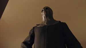 Tom after pulling a machete from his robe.