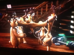 Blitzen gagging Vixen, Donner, Prancer and Tapir for nearly saying Rudolph's name.