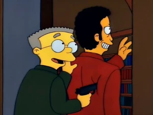Smithers pointing tom gun at Tom Jones.