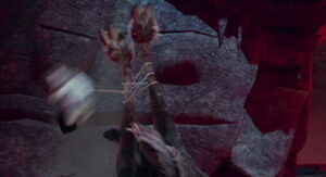 The koala doll tangles it's pullstring around Kazar's hooves, preventing him from escaping.