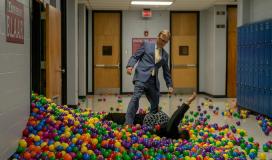 Dwight looking on as Vice Principal Ida Stricker falls victim to Rafe's second prank of putting plastic balls in the one of the school's closets.