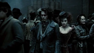 Mrs. Lovett and Sweeney walking through the marketplace.