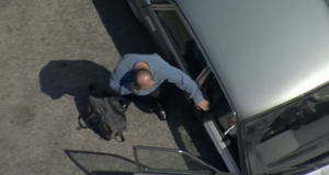 Phil is forced to leave his gun behind in his car (2001).