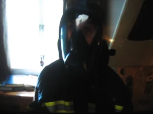 Andrew in his father's firefighter uniform.