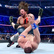AJ Styles slamming John Cena.