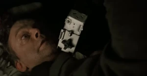 Adriana putting the noose-o-matic around Dr. Lloyd’s neck.