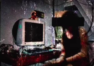 Rocío Yani, implied to be Lacey, connected to her computer.