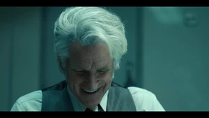 Brenner chuckling when Ten states his second drawing looks more like a cow than a dog.