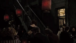 Mrs. Lovett and Toby serving customers in her shop.