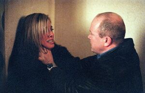 Phil threatens Mel after discovering that Steve has kidnapped Louise (2002).