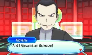 Giovanni introducing himself as the leader of Team Rainbow Rocket.