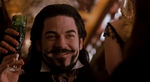 Arliss Loveless 6.jpg (85 KB) Loveless having a drink with Rita Escobar on board a train.