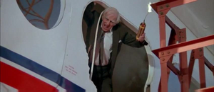 Glaub about to throw a lit dynamite to kill Bond to avenge Zorin's death
