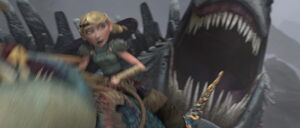 Red Death attempts to devour and kill Astrid and Stormfly by sucking them in