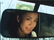 Dark Q smiling as she when outrunning the heroes.