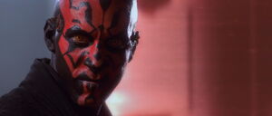 Maul taunts Jinn by walking by the force fields.