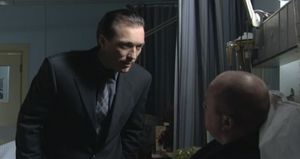Phil is threatened and taunted by Steve over being shot (2001).