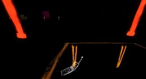 The orange table with the phone on it.