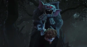 Bela laughs, as he holds Dennis and Winnie as hostages.