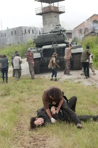 RickJumpsPhilip.jpg (126 KB) Rick tackling the Governor to the ground, which causes a brutal fight.