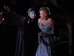 Claudin takes advantage of the death and destruction he caused and abducts Christine to his lair.