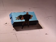 Ubu placing his late master on the table