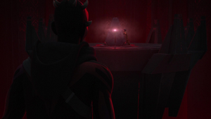 Maul watches as Ezra manages to reach the Sith holocron.