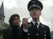 Von Berkow prepares to light the gypsy leader on fire.