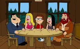 The Smiths sit down at table to talk with Buckle.