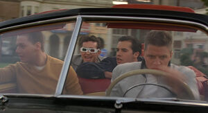 Biff and his gang drive after Marty.