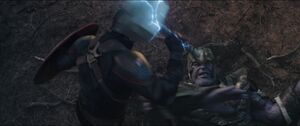 Thanos dodges Captain America's attack.