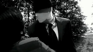 Slender Man choking Pavel.