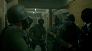 The Smileys preparing to break into other rooms to wipe out the occupants.