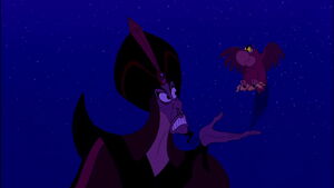 Iago handing Jafar the pieces of the golden scarab.