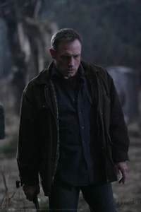 Azazel holding the Colt.