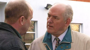 Phil Mitchell clashing with Frank's business partner Roy Evans.