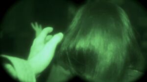 Bill reaching his hand out towards Clarice