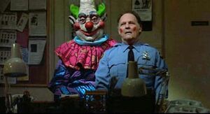 Jumbo using Officer Mooney as a ventriloquist dummy