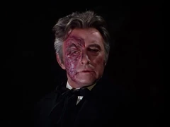 Claudin's mutilated face is revealed after Christine tares off his mask.