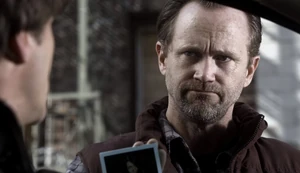 Schrader informs Muller that he has his wife.