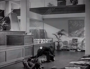 Grover and Duke attacking Ravelli while trying in vain to get the picture from him