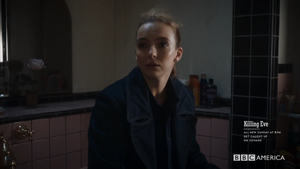 Villanelle threatening Konstantin, revealing she knows about his daughter.